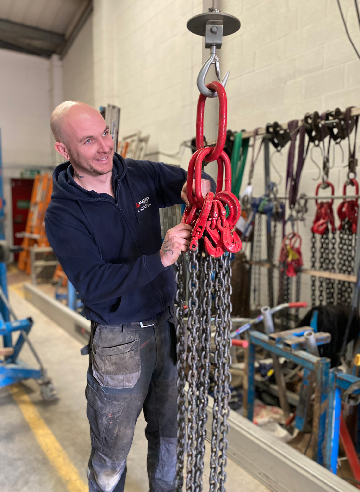 Engineer tagging lifting chains on site
